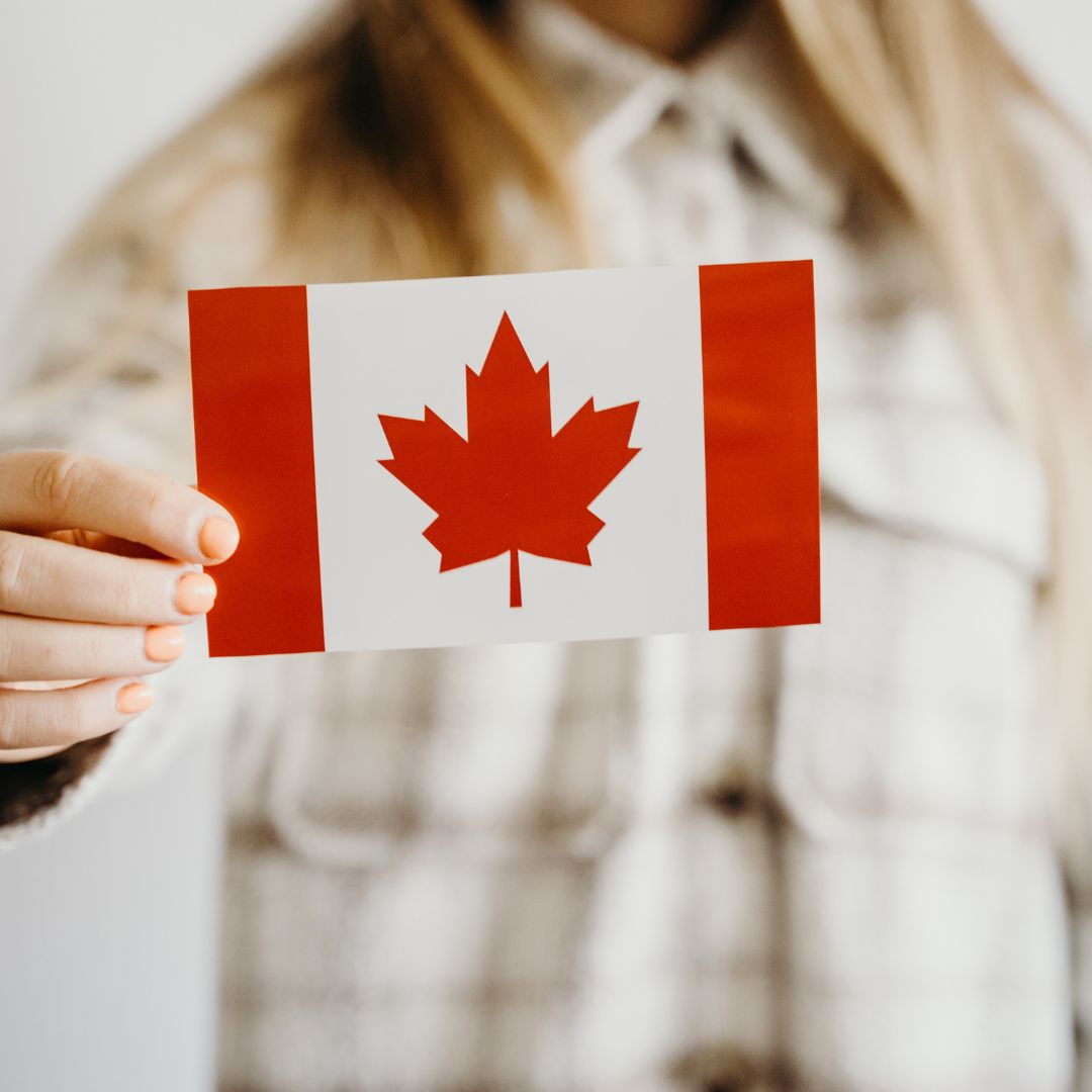 Canadian flag hold by a woman to appeal to buy Canadian skincare products