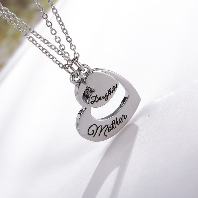 A big and a small silver heart pendant necklace