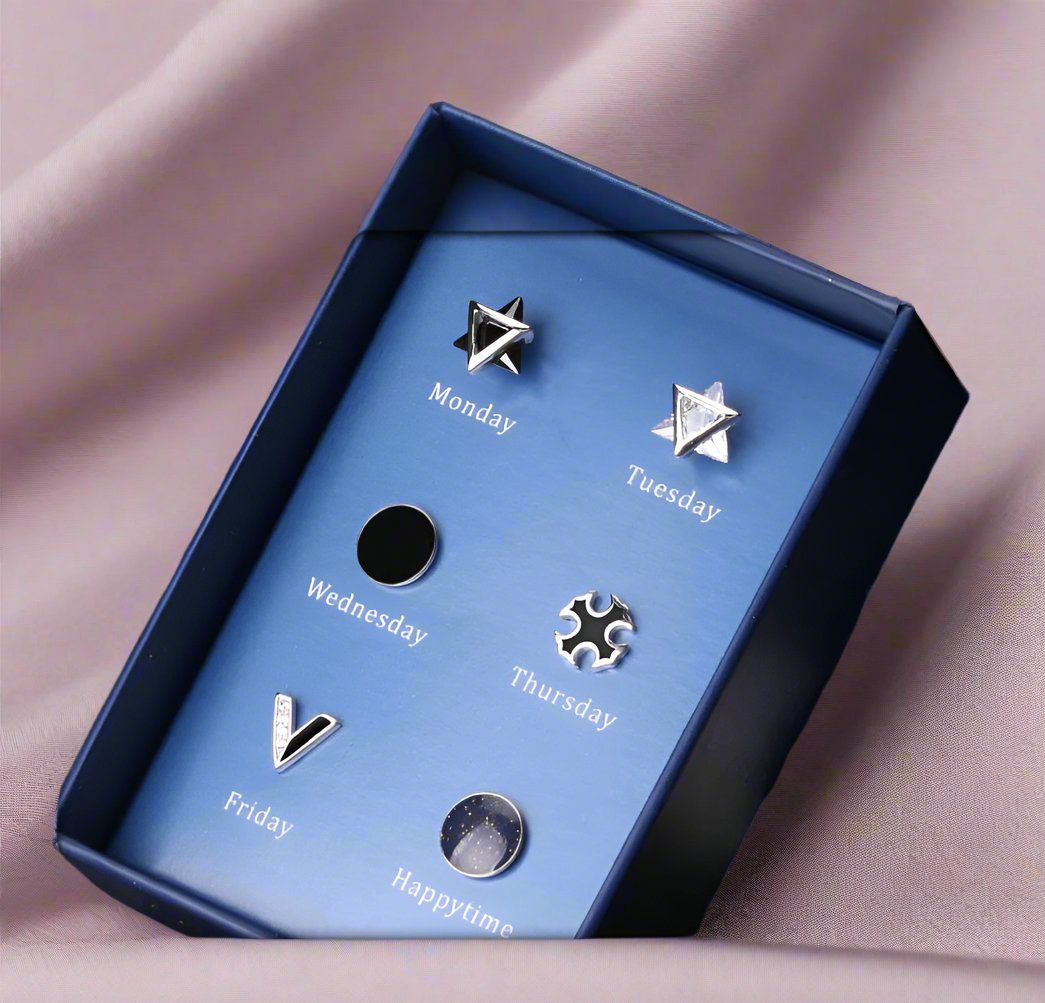 chic blue box with 6 ear studs for different days of the week