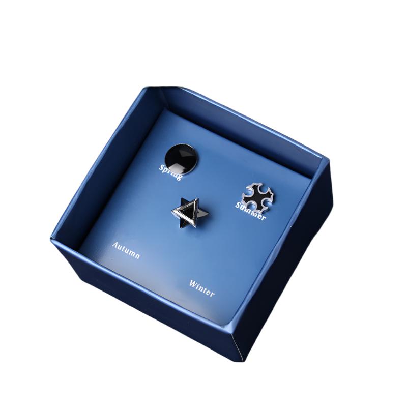 Three earrings for the four seasons in a blue box