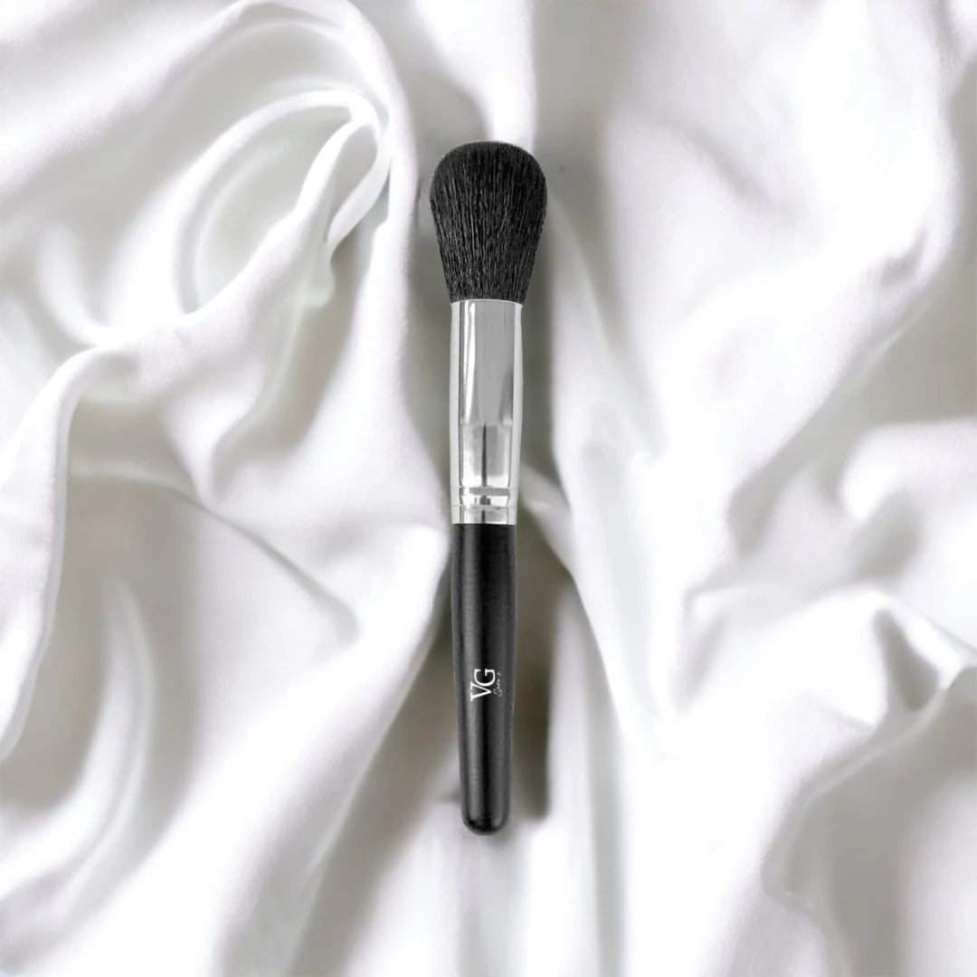 Brush Powder Blush Blender lying on a pristine white surface