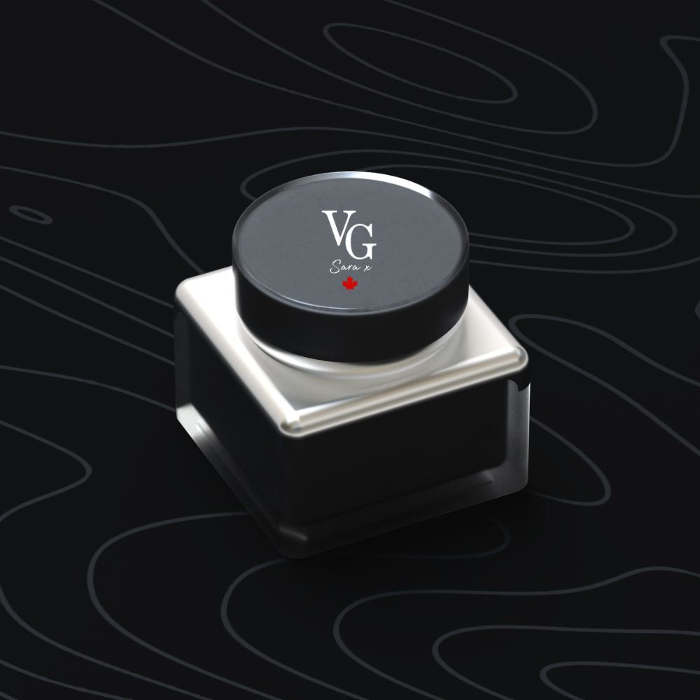  container of anti-aging day cream with logo VG sara x and a red Canadian leaf on a  black canvas