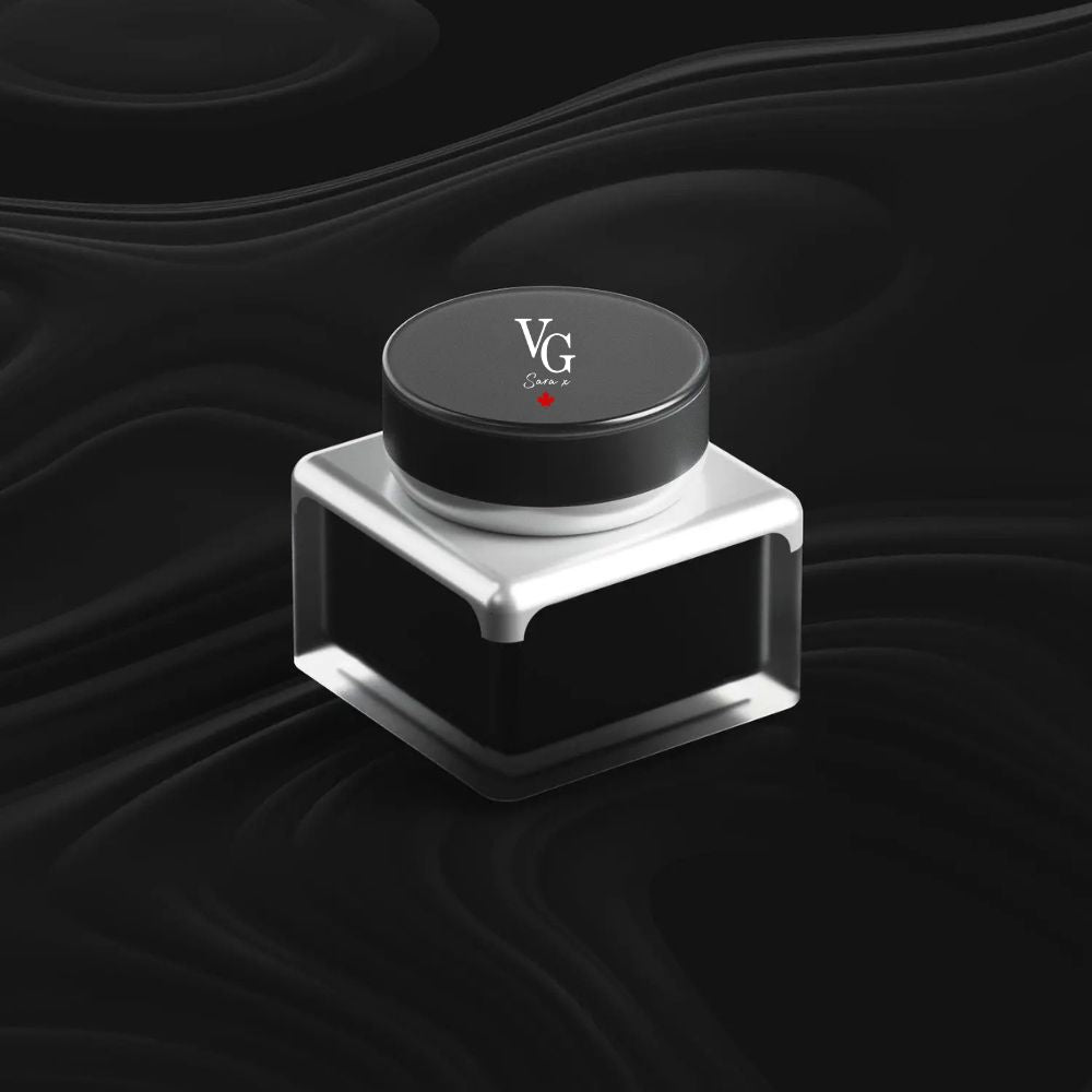 elegant container of cream with a logo Vg Sara x on a black canvas