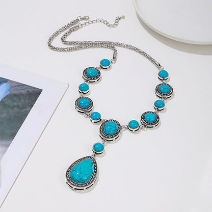 “An eco-friendly, polished alloy necklace with blue turquoise gemstones