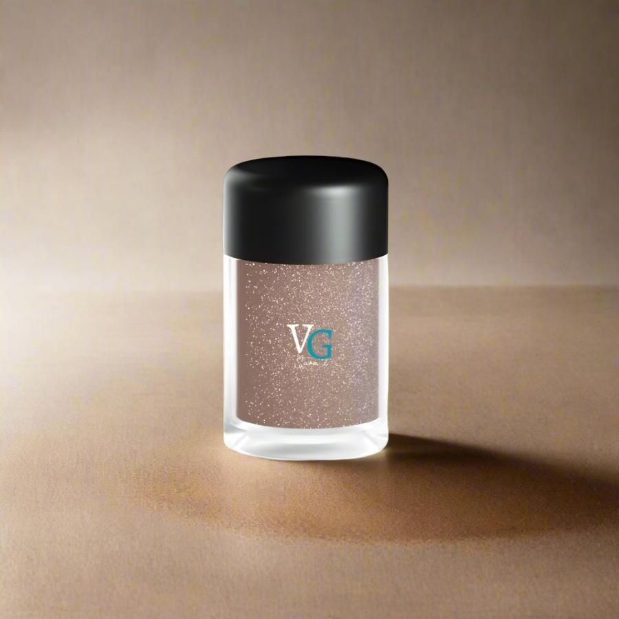 An elegant container of dust glitter on a  brown background
