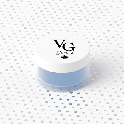 Jar with a white lid featuring 'VG Sara x' branding on a polka dot background