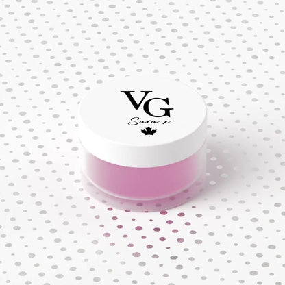 Pink container with a white lid featuring 'VG' branding on a polka dot background