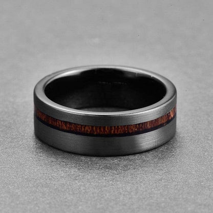 A black tungsten and acacia ring
