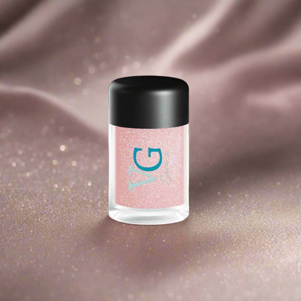 A bottle of Cruelty-Free Mineral Stardust Glitter with a pink hue on a white background