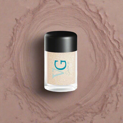 A bottle of fine Cruelty-Free Mineral Stardust Glitter on a pristine white surface