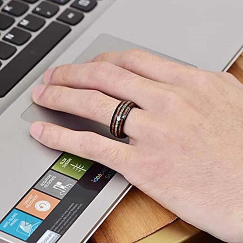 someone's hand wearing an Opal Black Tungesten Carbide Ring-Acacia wood