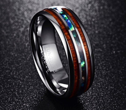 Side view of the abalone tungsten ring showing the detailed wood and shell inlay